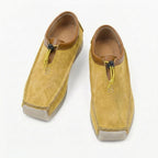 Leather and suede loafers with square toe and drawstring closure