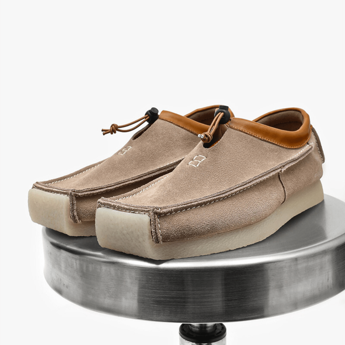 Leather and suede loafers with square toe and drawstring closure