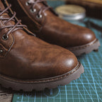Work boots with reinforced panels and padded interior