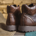 Work boots with reinforced panels and padded interior